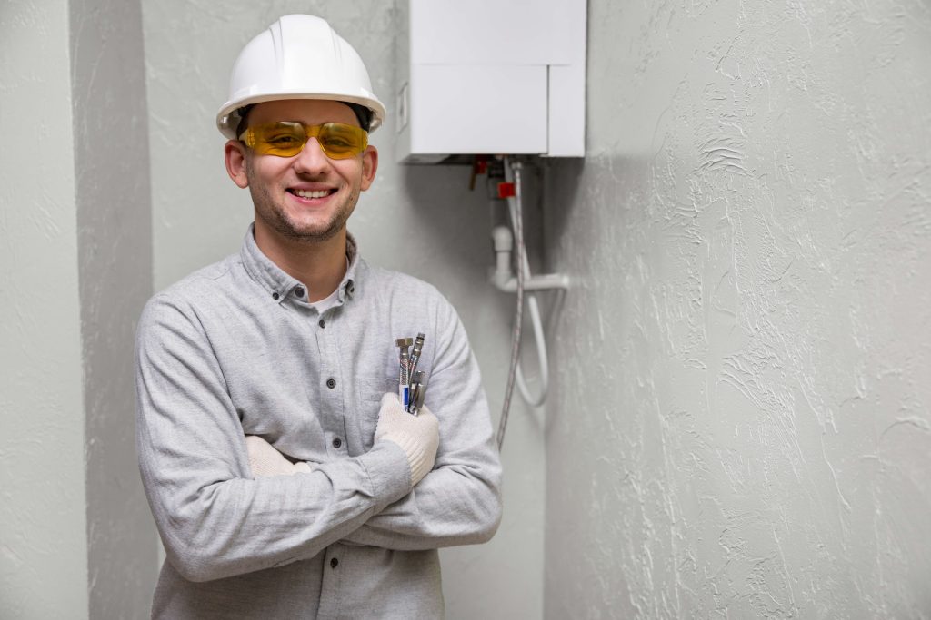 worker-repairing-water-heater-3-1-11zon
